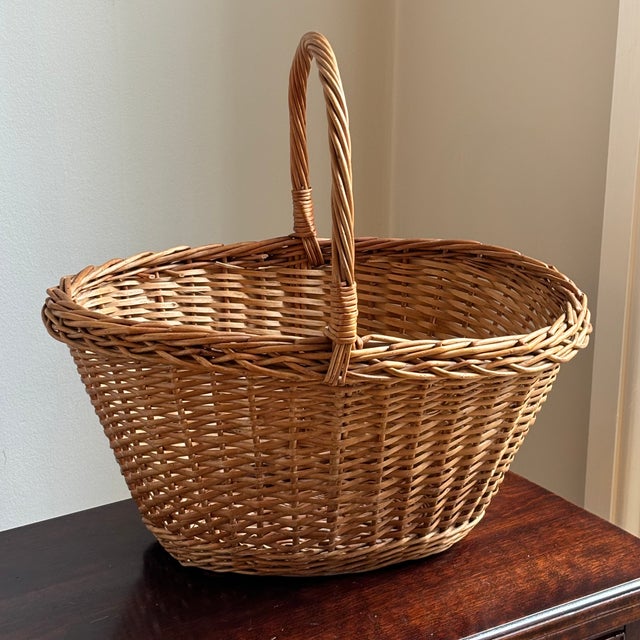 A lovely traditional farmhouse gathering basket, circa mid-20th century. Love the pretty french randing and warm, aged...