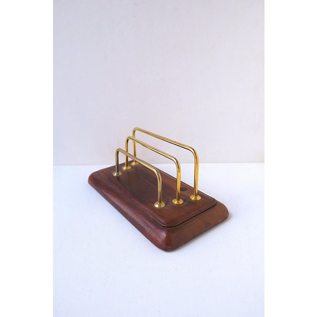 A brown leather and gold brass plate desk letter mail holder, Postmodern design, circa late-20th century. Hold mail,...