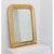 A classic French gilt mirror from the 19th century, in that iconic Louis Philippe arched frame, enclosing the original...