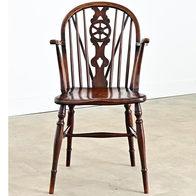 A handsome mid-19th century English elm wheelback Windsor chair that is solid and surprisingly comfortable. Hand-crafted...