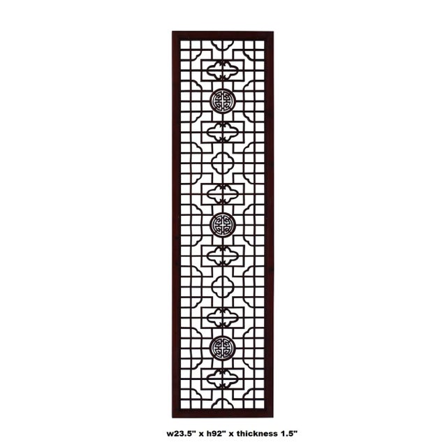 This is a handmade Chinese wood panel with geometric pattern surrounding round shape accent at the center. It is in...