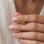 Infuse fresh, vibrant energy into your style with this striking three-stone pendant necklace, featuring two vivid olive-...