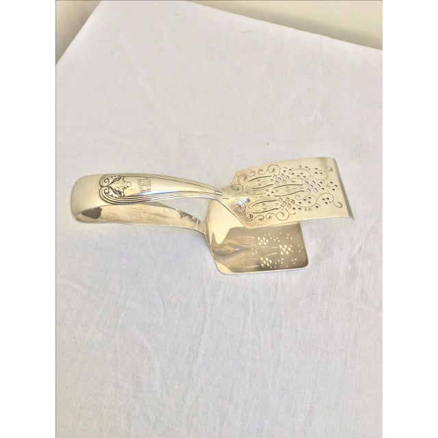 Antique Tiffany & Company colonial pattern sterling silver asparagus tongs from 1895. This item is monogramed.