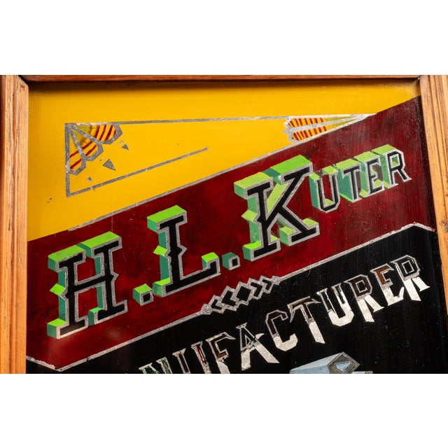 Early 20th-century reverse-painted glass advertising sign for H.L. Kuter of Shannon, Illinois, a manufacturer and dealer...