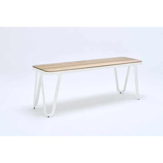 Loop bench 240 walnut by Sebastian Scherer Material: Aluminium, walnut Dimensions: D240x W38 x H45 cm. Weight: 30.5 kg...