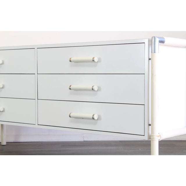 Vintage chrome and laminated credenza of six drawers This credenza has minor wear, the legs has some wear scratches and...