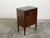 An Italian Neoclassical period walnut commode from the 18th century, with grey marble top and marquetry. Created in Italy...