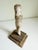 An early religious Santos figure or doll with rustic chipped paint finish attached to a rustic wood base. Likely Spanish...