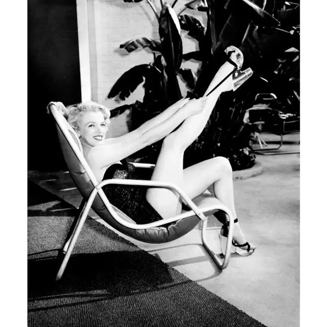 Marilyn Monroe: Hollywood's Glamour Icon This beautifully colored image features a pinup of actress and Hollywood...