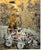 A cart laden with loosely defined forms moves across a dense ground of gold leaf, Stella working back into the gilding...