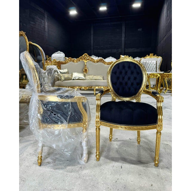 Enhance your space with this stunning French Rococo–style armchair. Fully restored with gold leaf, this chair features...