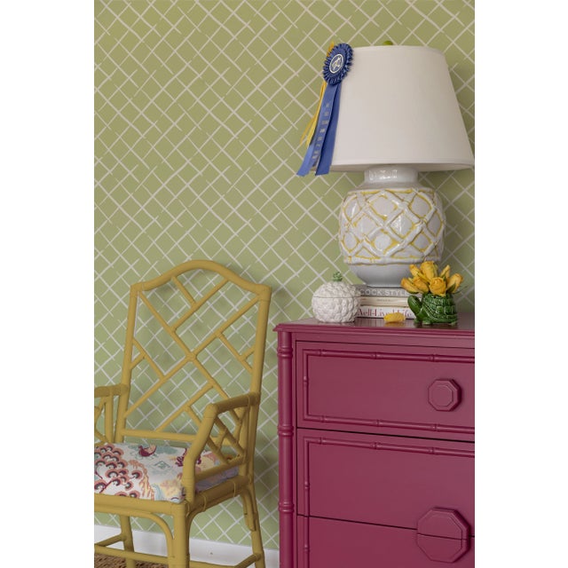 A sample of Bahama Court Meadow Green Wallpaper Care Instructions: Wipe with damp cloth.