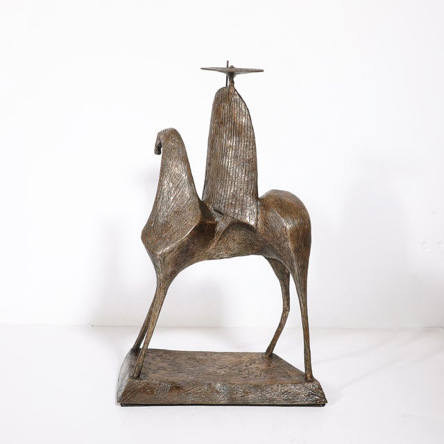 This Mid-Century Modernist bronze sculpture, signed by renowned artist Gloria Ellies and crafted circa 1960, is a powerful...