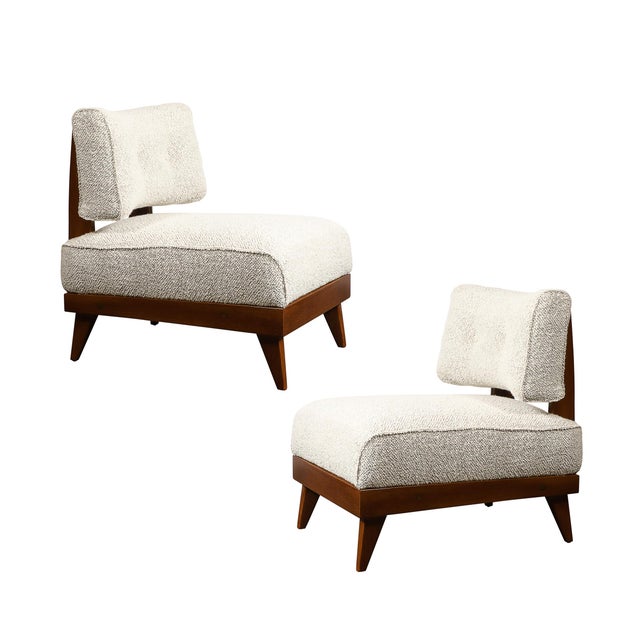 This striking pair of Mid-Century Modern lounge chairs combines bold sculptural design with unmatched craftsmanship,...