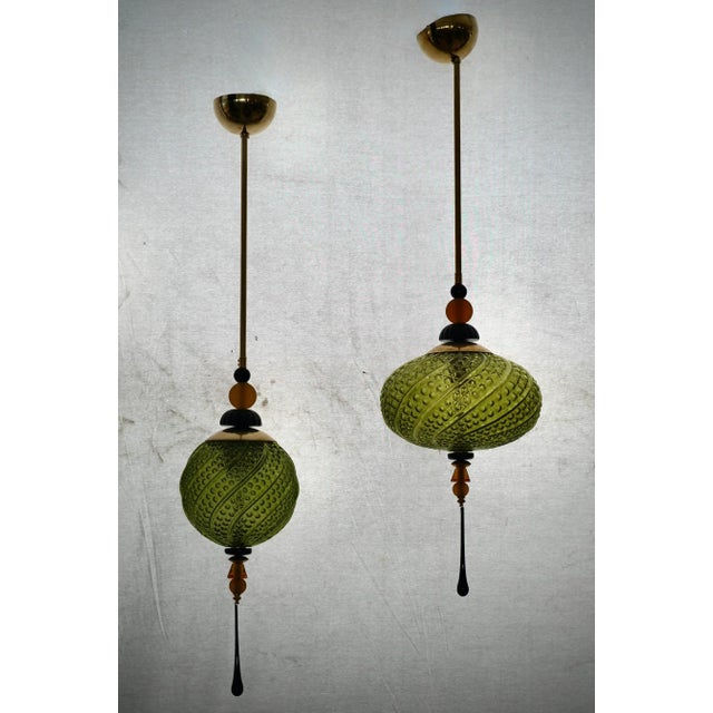 Precious Murano blown glass lanterns, whose colors are unique and range from green to black, passing through amber. These...