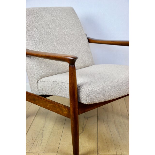 Gfm-64 armchair, designed by edmund homa in the 1970s, upholstered in beige boucle fabric. 2 pieces available. the gfm-64...