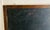 Vintage schoolhouse double sided black slate chalkboard, in brown oak frame metal hangers at top of frame for suspending