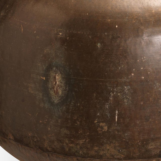 A striking mid-century brass vessel from Rajasthan, distinguished by its generous scale and beautifully balanced form....