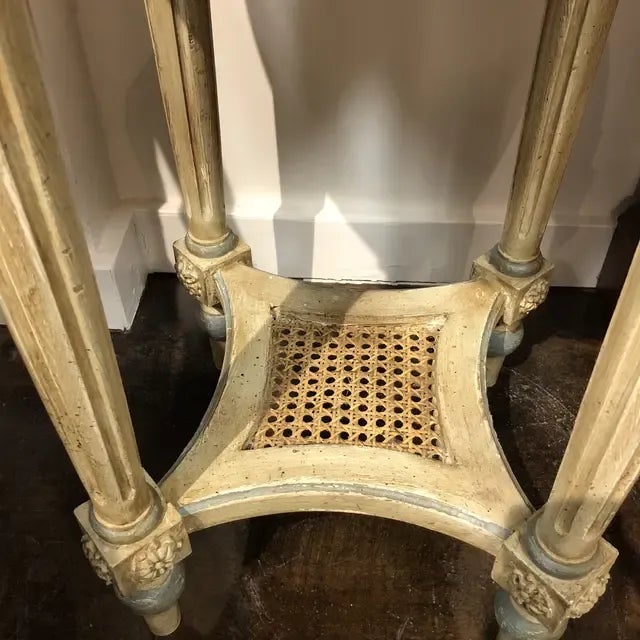 Hand carved wooden side/coffee table with four legs and a woven stretcher in shades of ivory accented with blue, featuring...