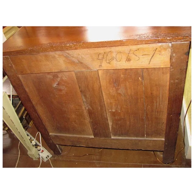 A French Louis XV Walnut commode, circa 1740. With graceful lines and fabulous hardware. It is 34" wide by 23" deep by 34"...