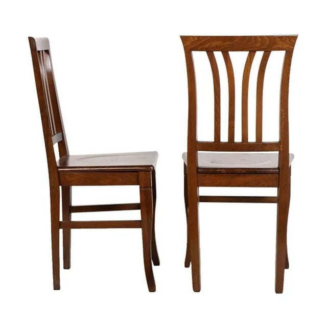 This pair of Art Deco Italian chairs in solid walnut was produced in the 1940s by Asolo and has been wax-polished.