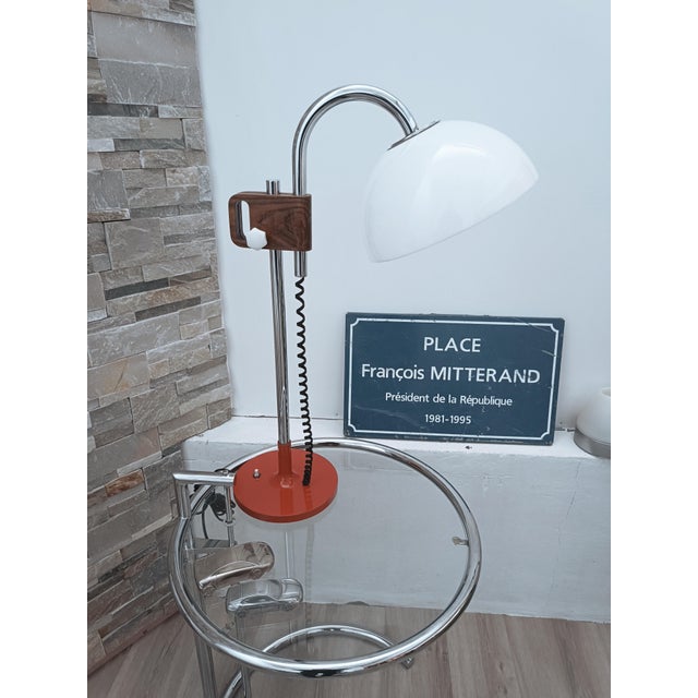 Magnificent designer table lamp by Pinokio. Spain, 1970s. Red lacquered metal base. The structure is chromed metal with a...