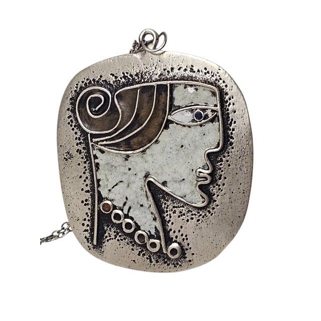 A 1960s fashion jewellery piece by master goldsmith János Percz. Silver-plated metal, finished with enamel. A unique,...