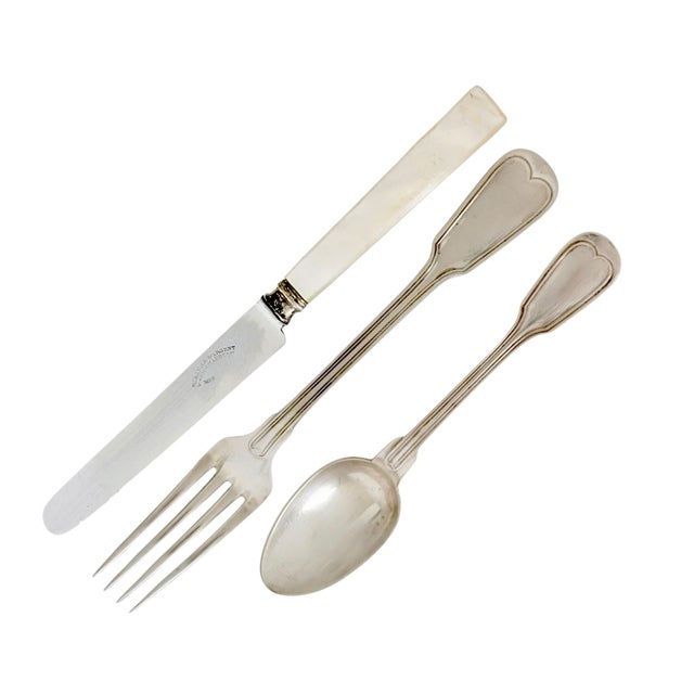 An elegant antique French silverplate cutlery service for six including six spoons, six forks, and six pearl handled...