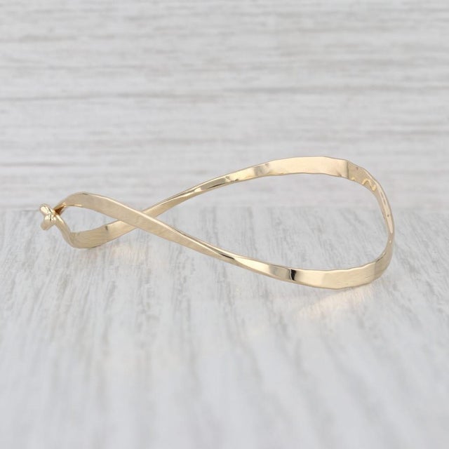Metal: 14k Yellow Gold Weight: 5 Grams Stamps: 14k TK Chain Style: Bangle Closure: Hook Inner Circumference: 6 1/2" Width:...