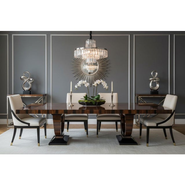 This exceptional large-scale executive dining table showcases the dramatic elegance of richly figured Macassar ebony...
