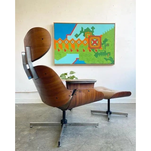 A Vintage Plycraft lounge chair and ottoman, a true icon of mid-century modern design. This set has been upholstered in...