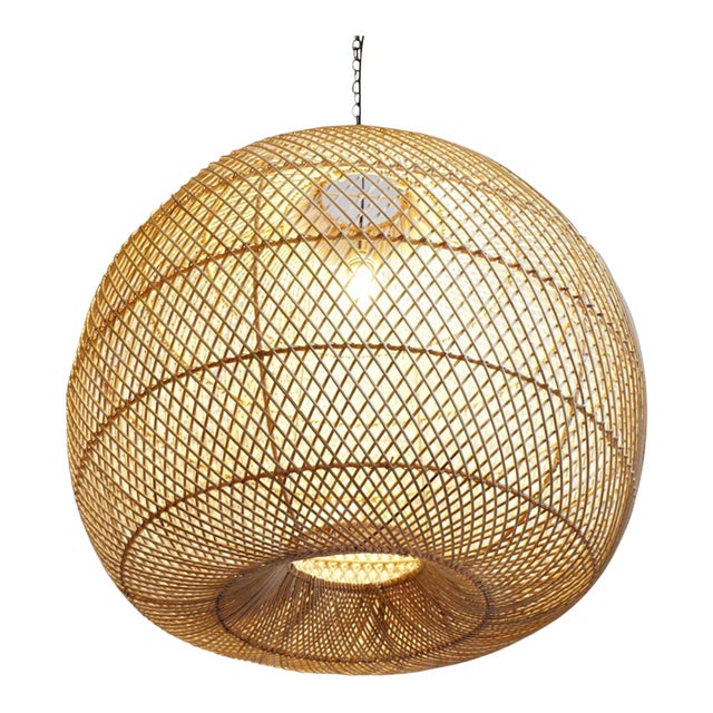 Fun and modern rattan globe lantern with rounded "donut hole" opening at bottom. Hand crafted piece for indoor use or if...