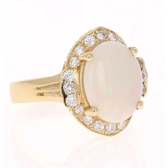 If you are on Opal lover, this ring is the perfect addition to your accessory collection! This ring has a Oval Cut Opal...