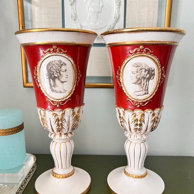 This is a sweet pair of vintage Italian ceramic vases made in a lovely cameo / silhouette design with gilt accents. They...