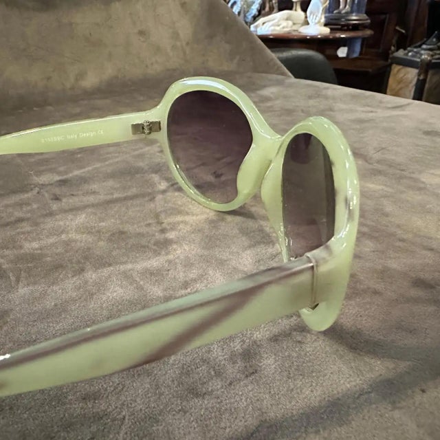 Chic 1990s "Bon Bon" Vintage Sunglasses in Faux Green Marble Acetate. These captivating vintage sunglasses from the 1990s,...