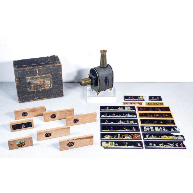 Magic lantern ep - ernst plank with 5 chromatrope discs and numerous glass slides, original box. Germany, late 19th...
