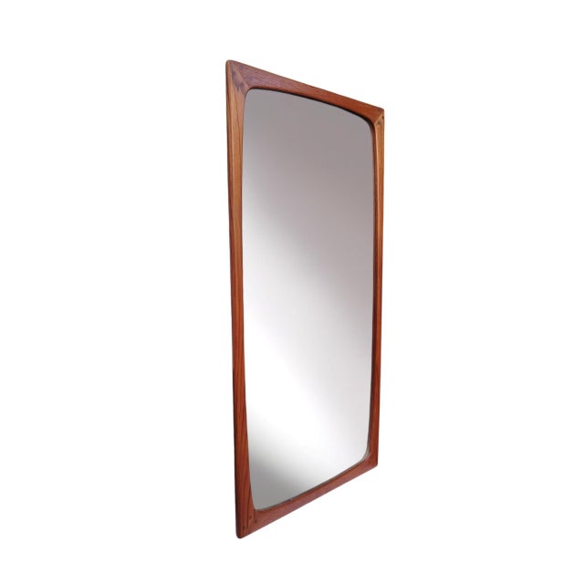 - Danish wall mirror produced in the 1960s, designed to be hung vertically. - Crafted from solid teak with excellent...