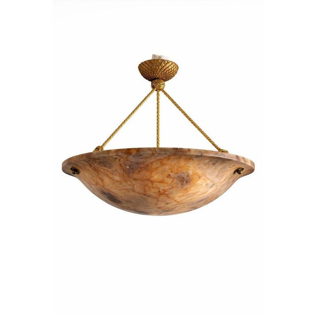An elegant Swedish pendant ceiling light crafted from beautifully veined alabaster, dating to the 1940s. The generously...