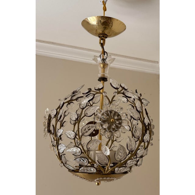 Beautiful Maison Bagues 4 light chandelier. Perfect size for an entryway, bedroom or bathroom. Covered in brass vines with...