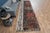 Vintage Hand-Knotted runner rug is a semi-antique vintage area rug. The '70s Eastern region of Anatolia's unique rug is...