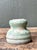 This vintage textured ceramic vase is a compelling example of mid-century studio pottery, celebrated for its organic form...
