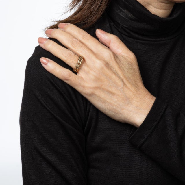 Stylish vintage Cuban curb link ring crafted in 14 karat yellow gold. The curb link ring measures 6mm wide (0.23 inches)...