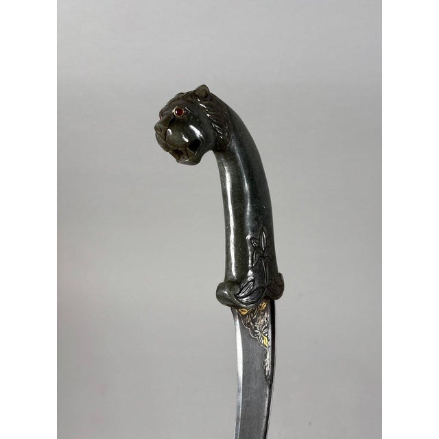 INDIA, Rajasthan. KARD Mughal Dynasty (1526-1857) The hilt is carved in spinach-green jade with a lion's head and eyes...