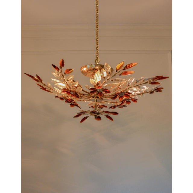 A spectacular monumental vintage crystal flower chandelier in the French Hollywood Regency tradition, closely matching...