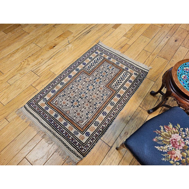Early 20th Century Baluch Tribal Area Rug in a Prayer Pattern in Ivory, Brown, Navy Blue For Sale - Image 10 of 11