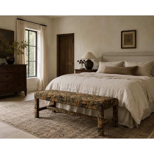 There’s a kind of quiet drama to a piece that hides its bones completely — every inch of this vintage bench, straight...