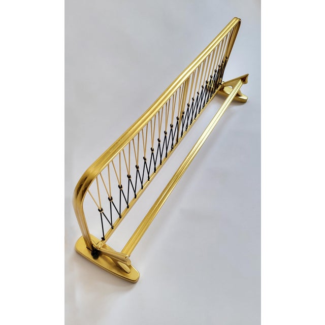 A sculptural, functional piece of mid-century design from the 1950s, space-saving and practical. Made in Austria. This...