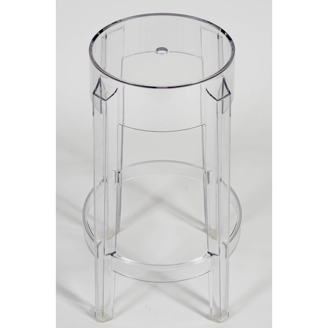 This Kartell Charles Ghost stool, designed by Philippe Starck, features a iconic 19th-century silhouette molded from a...