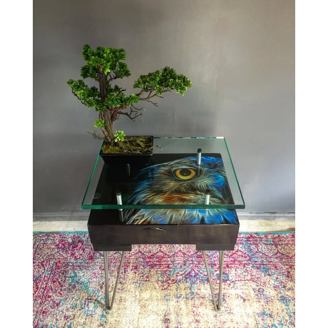 This owl table is made of wood sleepers, glass, and metal with artwork beneath the glass top. It is a handmade and British...