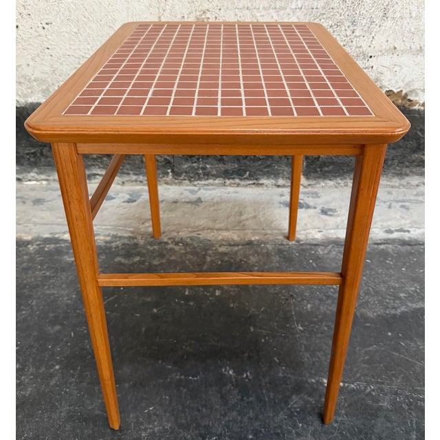 Handsome and functional petite Mid-Century Swedish Modern side, end or drink table, characteristic of high-quality...